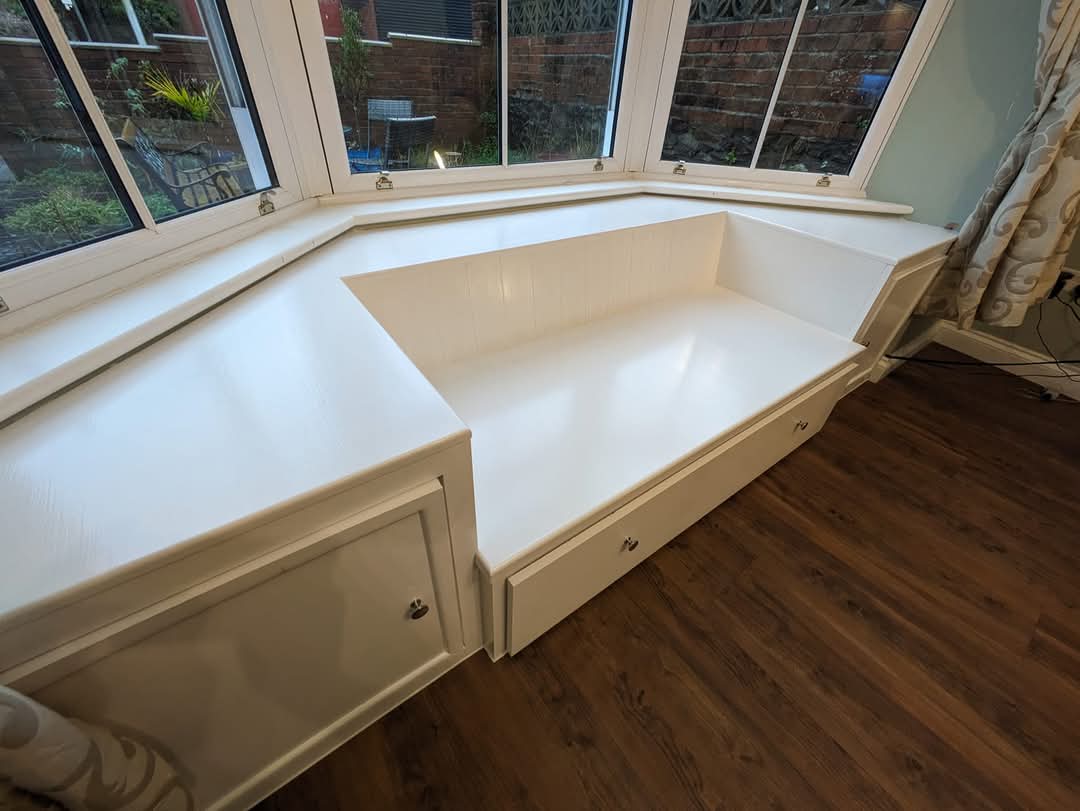 Bespoke painted bay window seat with built-in storage