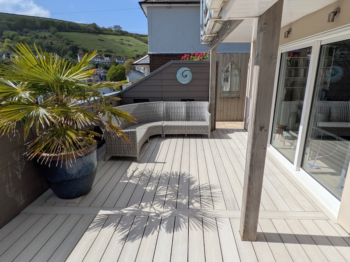 Pale composite decking terrace with a sea view in the South Hams