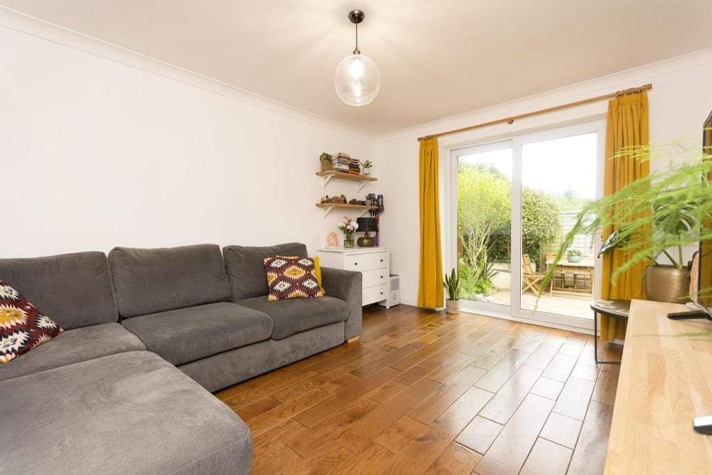 Living room with new timber flooring and fresh decorating